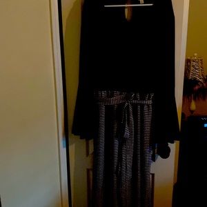 XL jumpsuit black on top hounds tooth check on bottom.